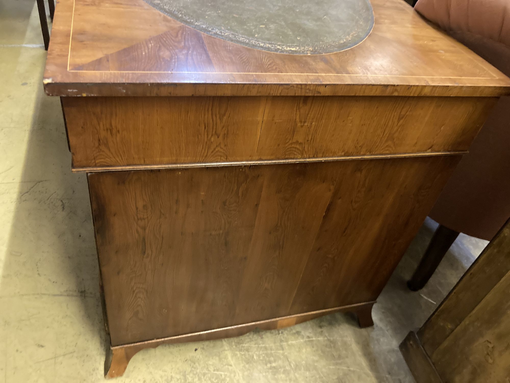 A George III style yew pedestal desk, length 122cm, depth 69cm, height 74cm